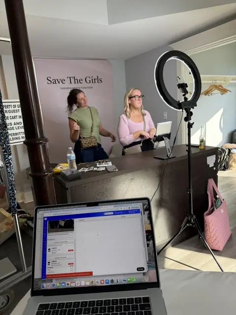 A live sale set up with ring light and laptop